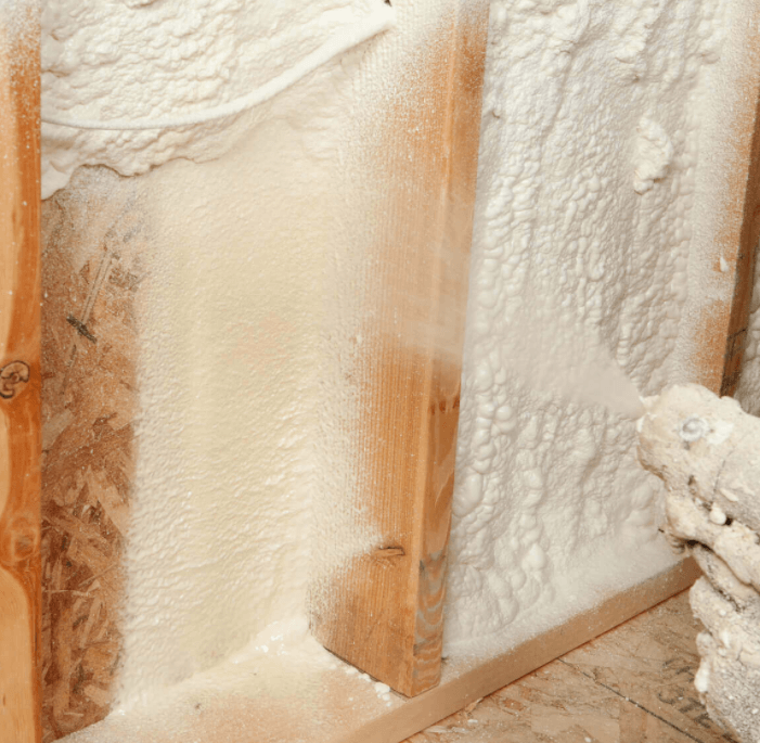 spraying spray foam insulation