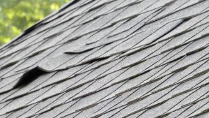 Close up of roof with curling shingles