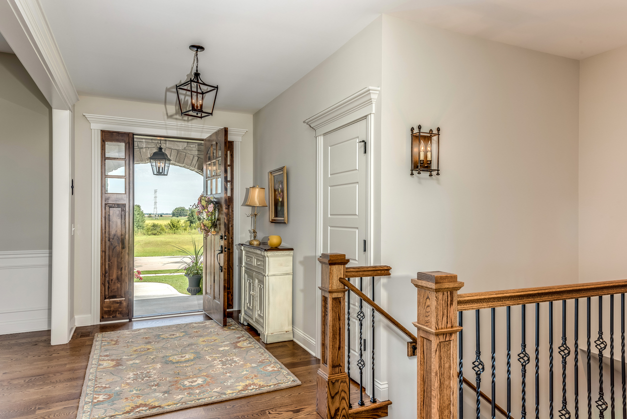 Exterior View Of The Open Front Door To A Residence With The